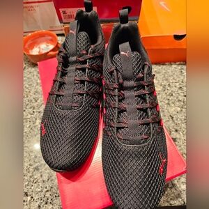 Mens size 12 black and red Puma shoes